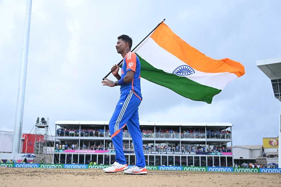 Hardik Pandya took an Indian flag with him to the middle of the pitch on which India had created history and just stood there, staring down at the surface Hardik Pandya took an Indian flag with him to the middle of the pitch on which India had created history and just stood there, staring down at the surface